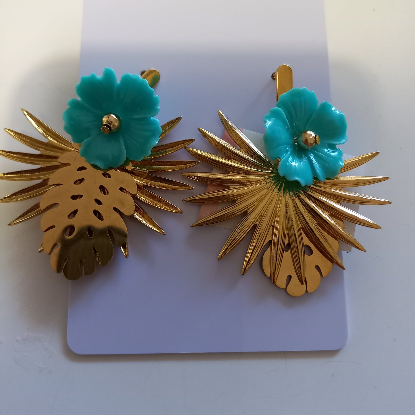 Turquoise flower with leaves